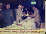 Award winning Cosmetic implants dentist dr bharat agravat by Gujarat state Governor His Excellency Krishnapal Singh.